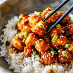General Tso’s Chicken recipe that is BAKED, not fried, smothered in an irresistible sweet and spicy, zingy sauce and about to become your favorite Chinese food fakeout takeout!