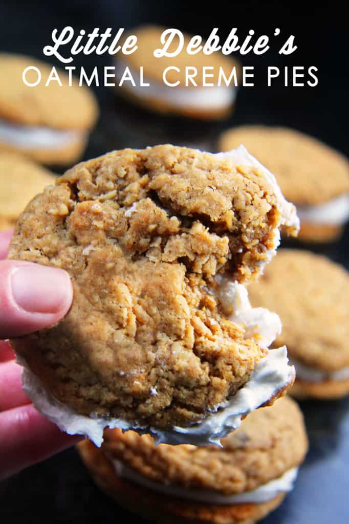 These Little Debbie's Oatmeal Cream Pies copycat are melt-in-your-mouth addicting.ย The cookies are bursting with buttery, chewy, brown sugar, molasses oatmeal which sand whichย a luscious creamy vanilla center.ย After one bite, you will never want to buy Little Debbies' Oatmeal Cream Pies ever again! side view of homemade oatmeal cream pies with a bite taken out of one of the cookies