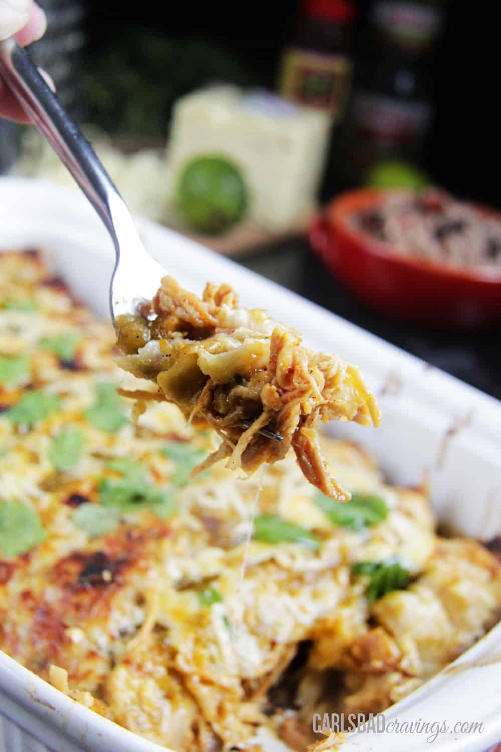 up close of a forkful of salsa verde chicken enchiladas