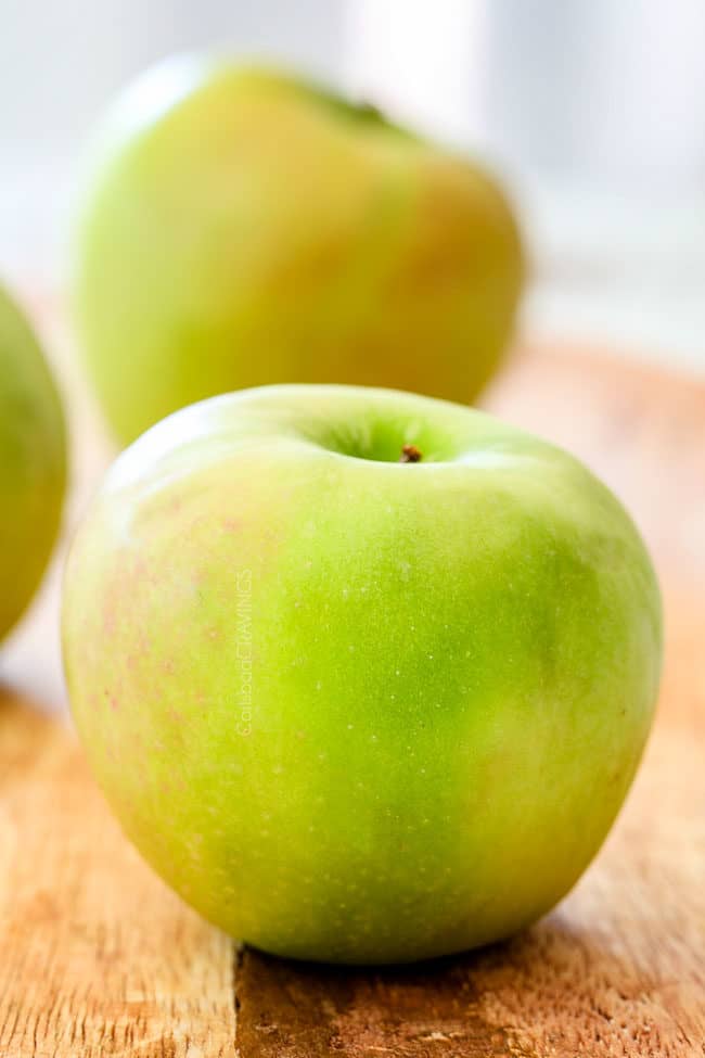 up close of Granny Smith Apples on a cutting board to show which apples are best for Apple Syrup