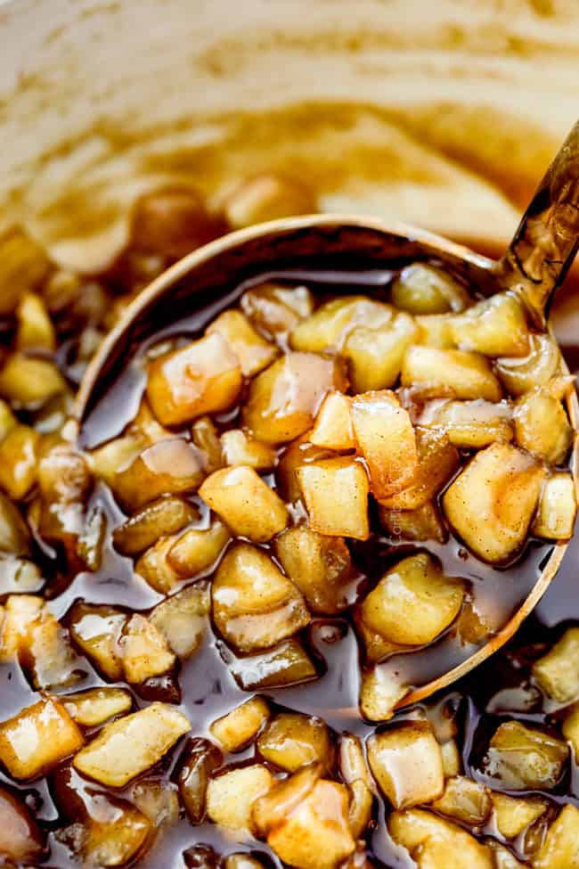 up close of a ladle full of chunky apple syrup