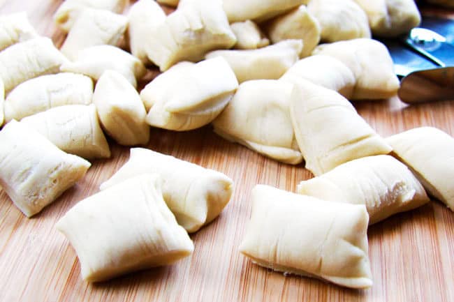showing how to make Pretzel Bites by cutting the dough into squares