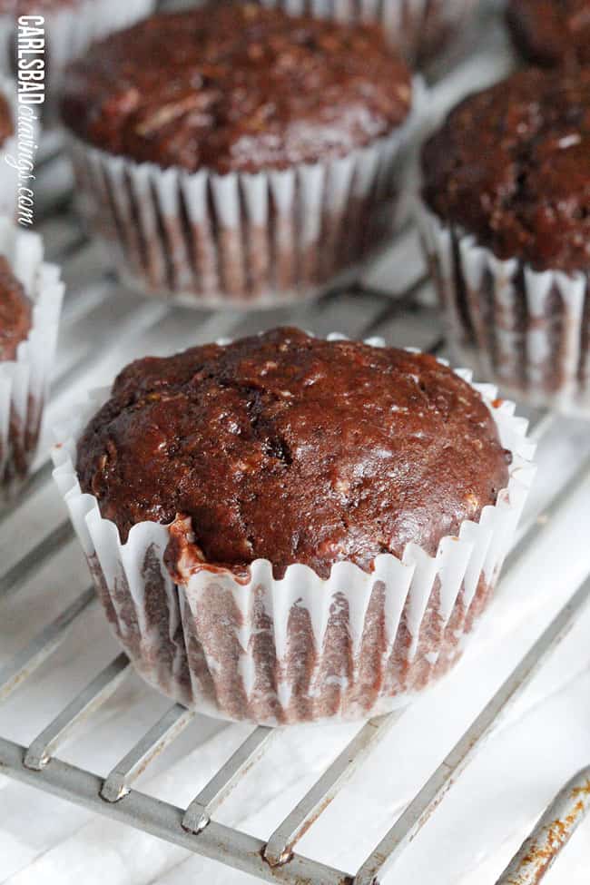 Chocolate Zucchini Muffins with DOUBLE the CHOCOLATE, ZERO added fat and a whole lot of yum!! This Chocolate Zucchini Muffins Recipe is baked with applesauce and vanilla yogurt that are crazy moist and chocolaty!ย You will devour these by the handfuls - becauseย you can! Chocolate Zucchini Muffins with DOUBLE the CHOCOLATE, ZERO added fat and a whole lot of yum!! This Chocolate Zucchini Muffins Recipe is baked with applesauce and vanilla yogurt that are crazy moist and chocolaty!ย You will devour these by the handfuls - becauseย you can!