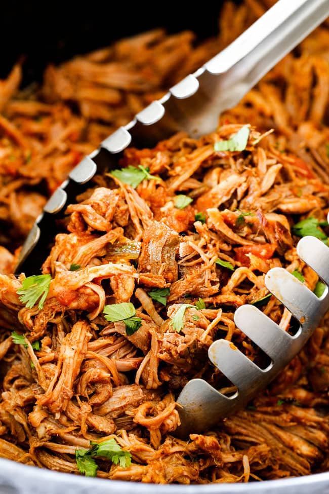 up close of tongs picking up best cafe rio sweet pulled pork