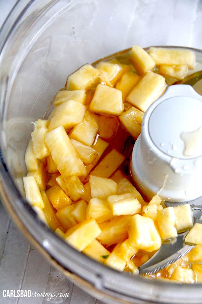 showing how to make dressing for cashew chicken salad by adding pineapple to a blender