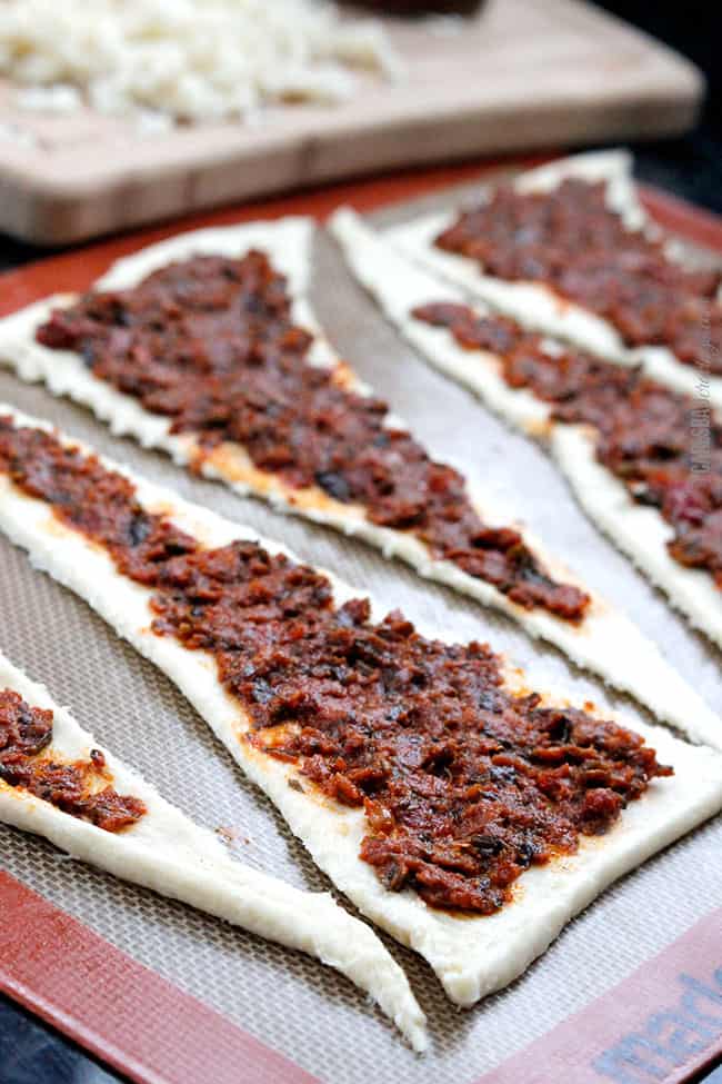 showing how to make crescent roll recipe by adding bruschetta to the crescent roll dough