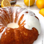 Drizzling lemon glaze on Lemon Poke Cake.