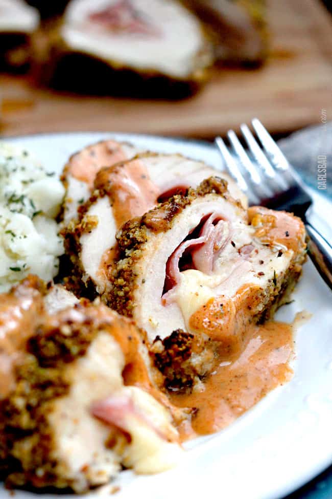 easy chicken cordon bleu recipe on a plate with chicken cordon bleu sauce and mashed potatoes