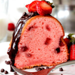 Rich, buttery, tender Strawberry Pound Cake swirled with fresh strawberries and smothered in smooth, silky Chocolate Ganache. 1000X better than any cake mix and so drool worthy everyone will beg you for the recipe!