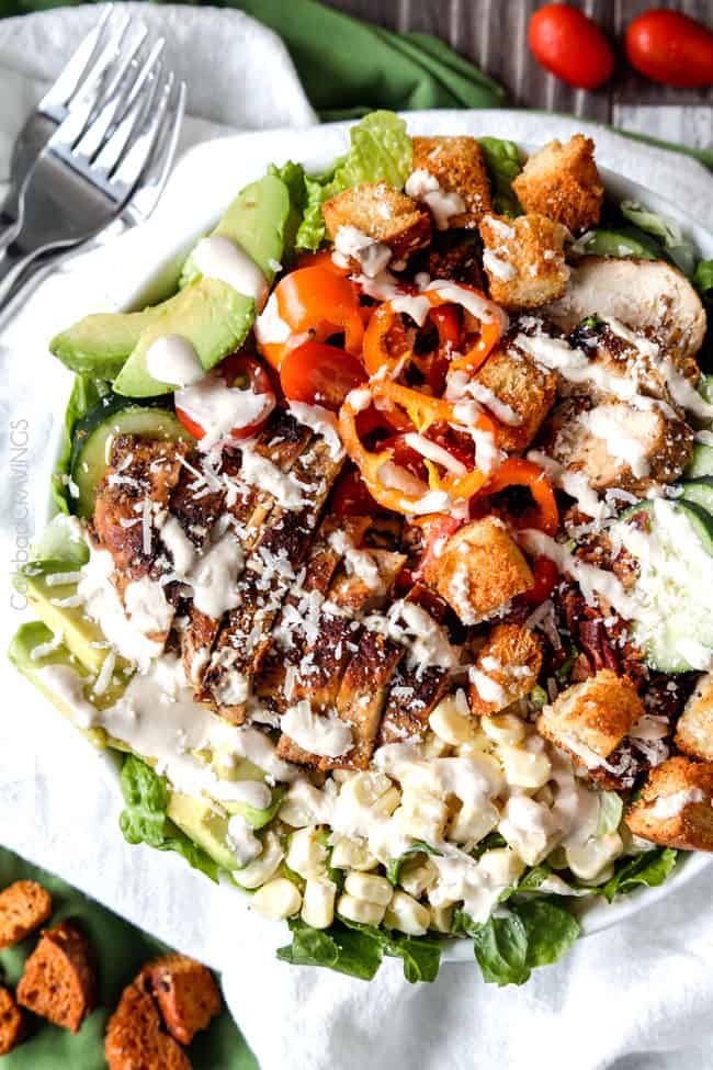 Garden Caesar Salad bursting with not only Parmesan cheese and homemade croutons but crispy bacon, fresh corn, avocados, tomatoes, cucumbers etc. and the most tender, juicy Lemon Basil Chicken all bathed in luscious homemade Caesar Dressing.