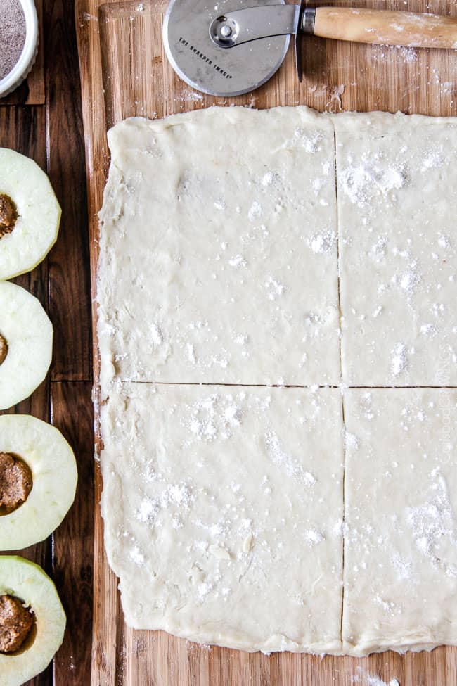 showing how to make apple dumplings by rolling out dough hand slicing it in quarters