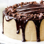Crazy moist Caramel Milk Chocolate Cake, busting with milk chocolate toffee bits, coated in Caramel Icing and smothered in silky chocolate ganache. THE only chocolate cake recipe you need!