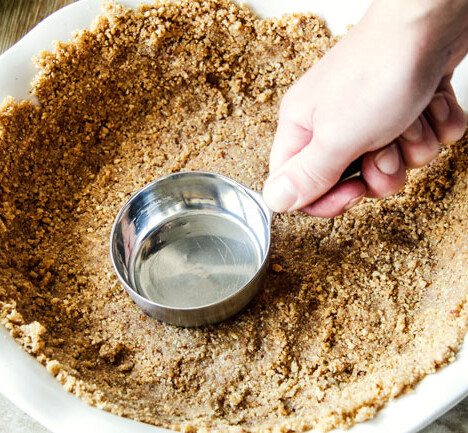 Easy thick, buttery, NO FAIL Pecan Graham Cracker Crust with only 4 ingredients is perfect for every pie!