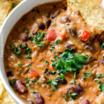 Homemade Cheesy Chili Dip or Soup is LOADED with your favorite chili ingredients, spices and SO irresistibly cheesy with NO processed cheese! Serve as a crowd pleasing appetizer or simply thin for THE most addicting soup! my favorite dip ever!