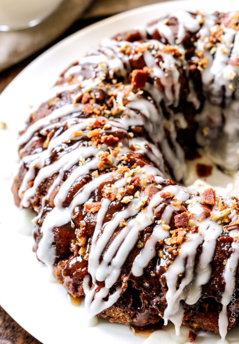 Maple Bacon Cinnamon Roll Monkey Bread made easy with refrigerated cinnamon rolls and made irresistible with maple crispy crumbled bacon, pecans and a maple caramel topping. The perfect special occasion breakfast, brunch or dessert!