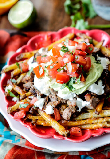 Forget the nachos, these Loaded Carne Asada Fries are so addictingly delicous! baked Mexican spiced French fries smothered in cheese and piled high with tender juicy steak, salsa, avocado crema, etc.
