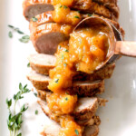 Company pleasing Cajun Pork smothered in Tangy Pineapple Glaze is sweet and spicy and melt in your mouth tender! The layers of flavor or out of this world!