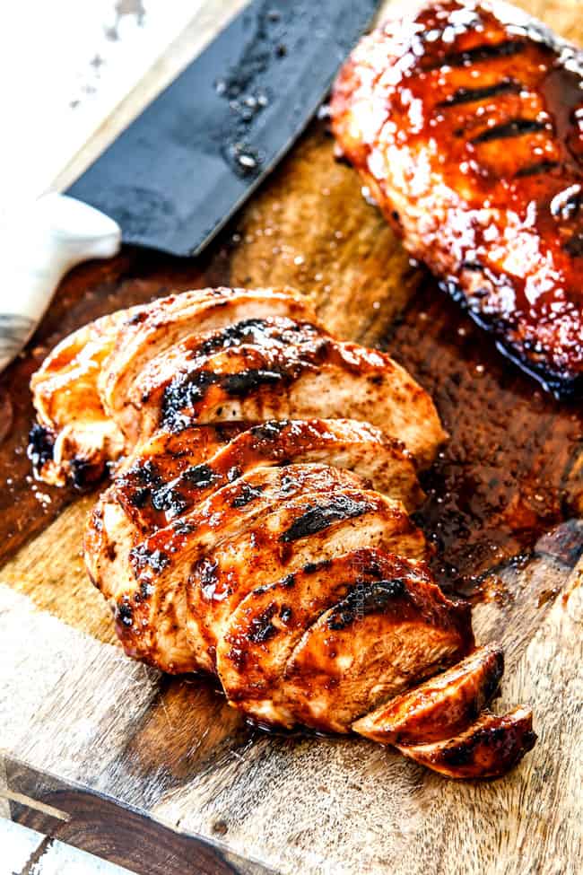slicing Buffalo Chicken on a wood cutting board
