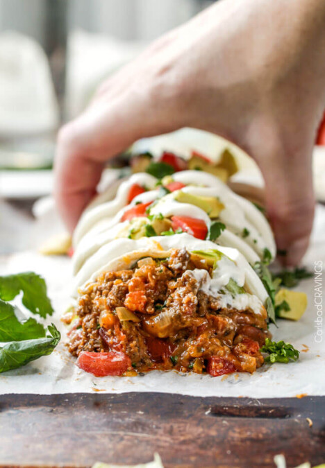 Quick, easy, comforting, inexpensive Beef and Bean Burritos stuffed with the BEST FILLING you will be eating with a spoon! #cincodemayo #30minutemeals