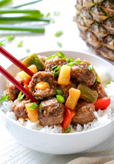 Tender Slow Cooker Hawaiian Meatballs are bathed in the most amazing sweet and tangy sauce and STUFFED with pineapple in every bite!! An incredible make ahead appetizer or family favorite dinner!