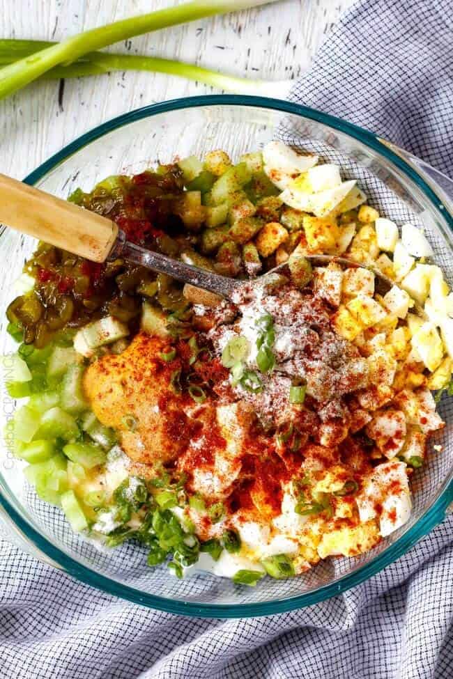 Everyone needs the best potato salad recipe and this is it! so creamy and flavorful and disappears in minutes whenever I take it any where - everyone always asks for the recipe!! showing how to make potato salad by adding potatoes, celery, eggs, mayonnaise, sour cream, mustard to a large glass bowl