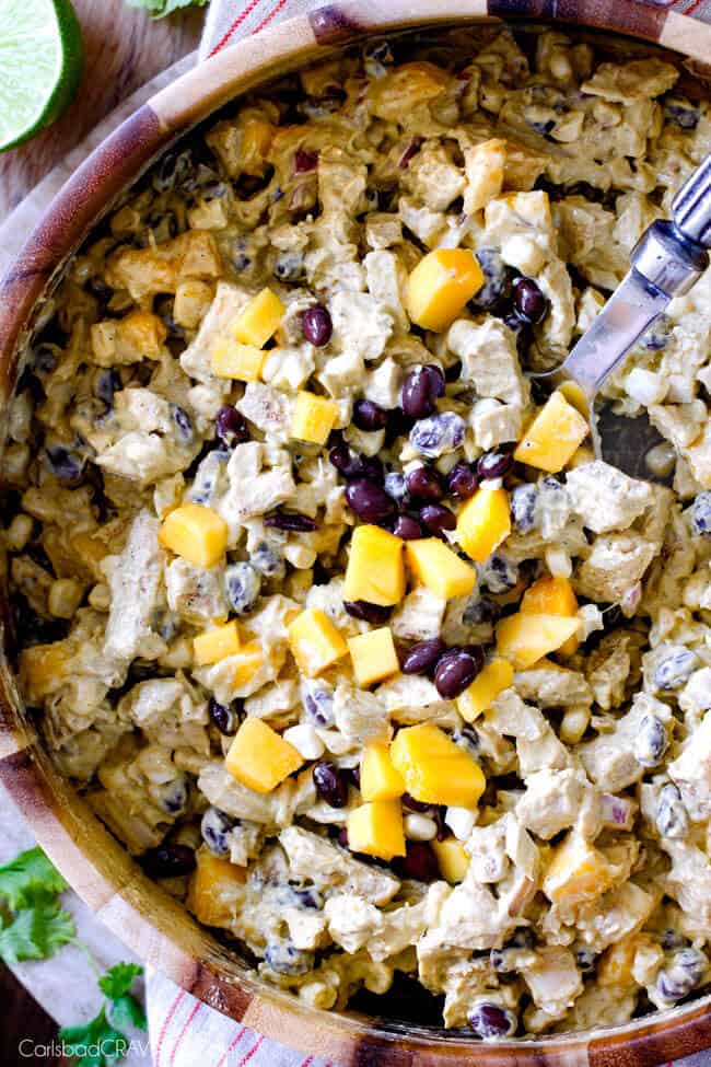 These Avocado Chicken Salad Sandwiches are my favorite way to use leftover chicken! They are super easy, creamy, flavorful, refreshing and I love the Mexican spices and crunch of tortilla strips! Showing how to make Avocado Chicken Salad by combining filling and avocado dressing in a bowl