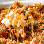 This mega creamy Million Dollar Macaroni and Cheese Casserole is the only macaroni cheese recipe you will ever want to make! make this for guests or family and they will love you forever! The homemade sauce itself is rich and crazy creamy and the casserole is stuffed with a hidden layer of provolone cheese and sour cream that melts when baked for a ridiculous amount of velvety creamy, cheesy goodness.