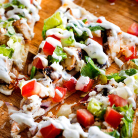 Chicken Gyro Flatbread Pizzas โ these are amazing and SO quick and easy! An explosion of flavors and textures with the most flavorful Greek Chicken and easy Blender Tzatziki! Great for lunch/dinners or for appetizers and entertaining!