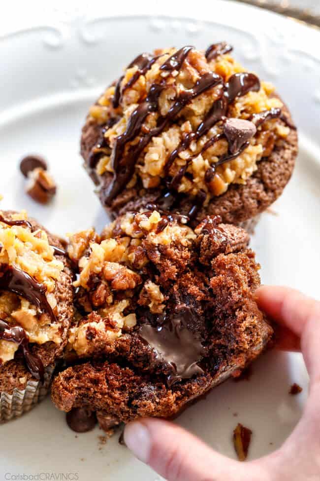 5 Minute Fool Proof Chocolate Ganache (sauce) is silky, creamy, sweet and 1,000 TIMES BETTER than any store bought chocolate sauce. Perfect for brownies, ice cream, cakes, popcorn, strawberries, etc side view of a chocolate ganache cupcake sliced open showing chocolate ganache center