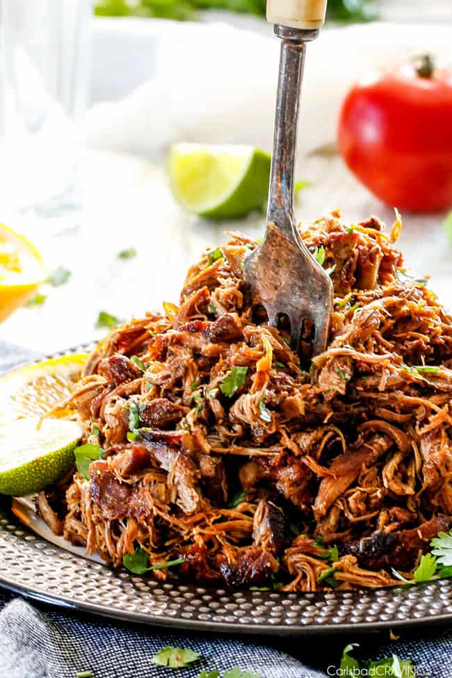 plate of mexican pulled pork with fork sticking up from middle