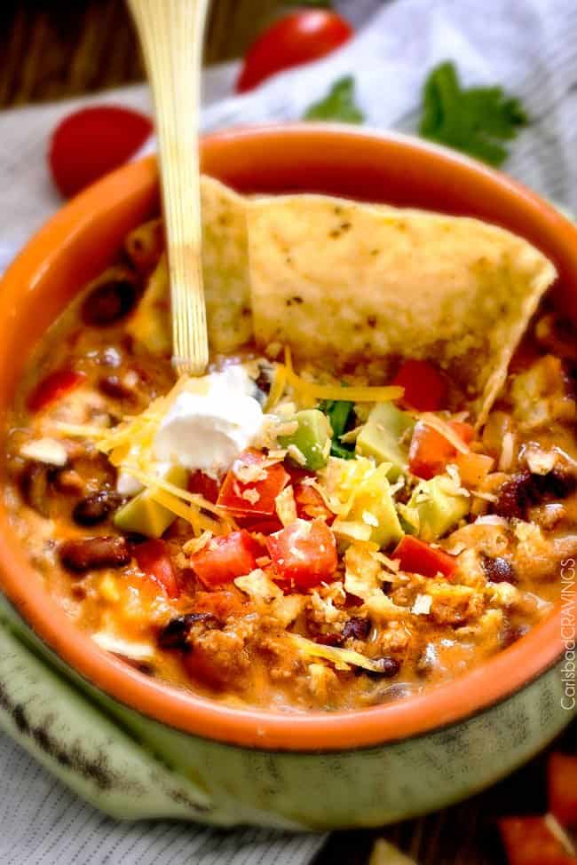 Less than 30 minutes for this ONE POT Cheesy Taco Soup! This is the ultimate comforting soup packed with all your favorite taco flavors and is SO easy and great for crowds! You havenโt had taco soup until you try this version!