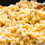 This mega creamy (lightened up) Salsa Verde Pepper Jack Macaroni and Cheese is crazy flavorful infused with salsa verde, pepper jack and sharp cheddar and super easy to make! A new family favorite on the table in under 30 minutes (including the option of chicken and veggies)!