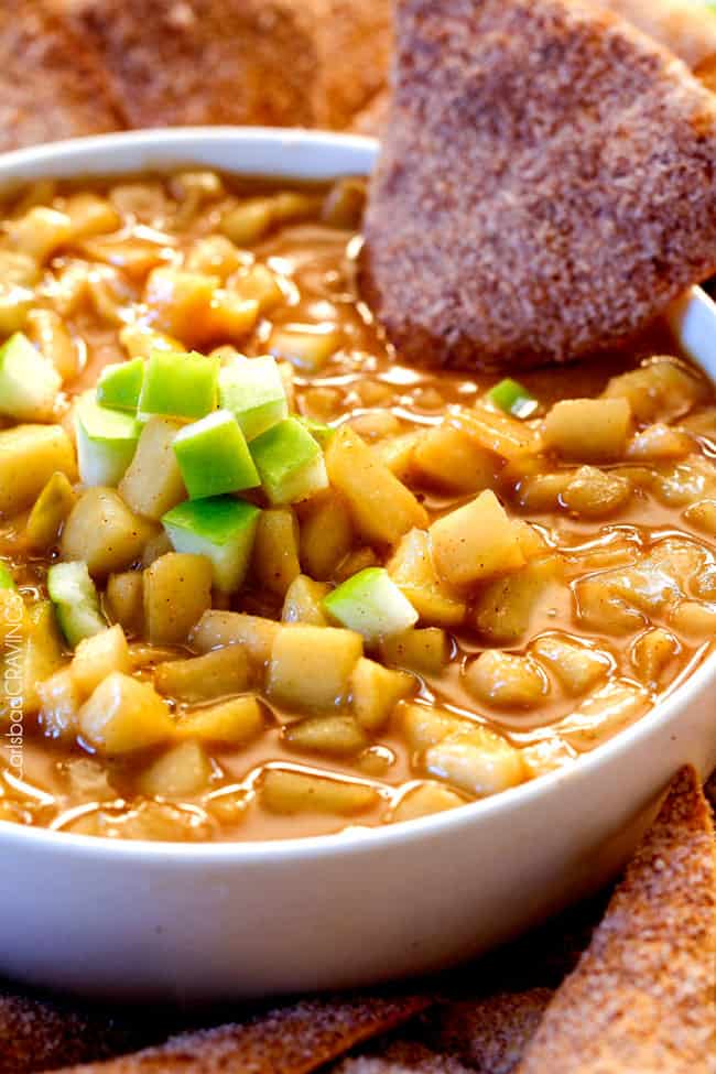 Salted Caramel Peanut Butter Apple Pie Dip - I cannot stop eating this dip!!! Warm, cinnamon brown sugar apples smothered in peanut butter caramel sauce AKA INSANE!! #thanksgiving #appetizer #Fall