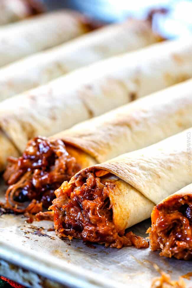 BBQ Pork Taquitos baked on a baking sheet.