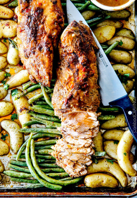Sheet Pan Chili Dijon Pork Tenderloin with Green Beans and Potatoes all baked on ONE PAN! This is the most tender pork I have ever had and the tangy sweet and spicy flavors are out of this world!