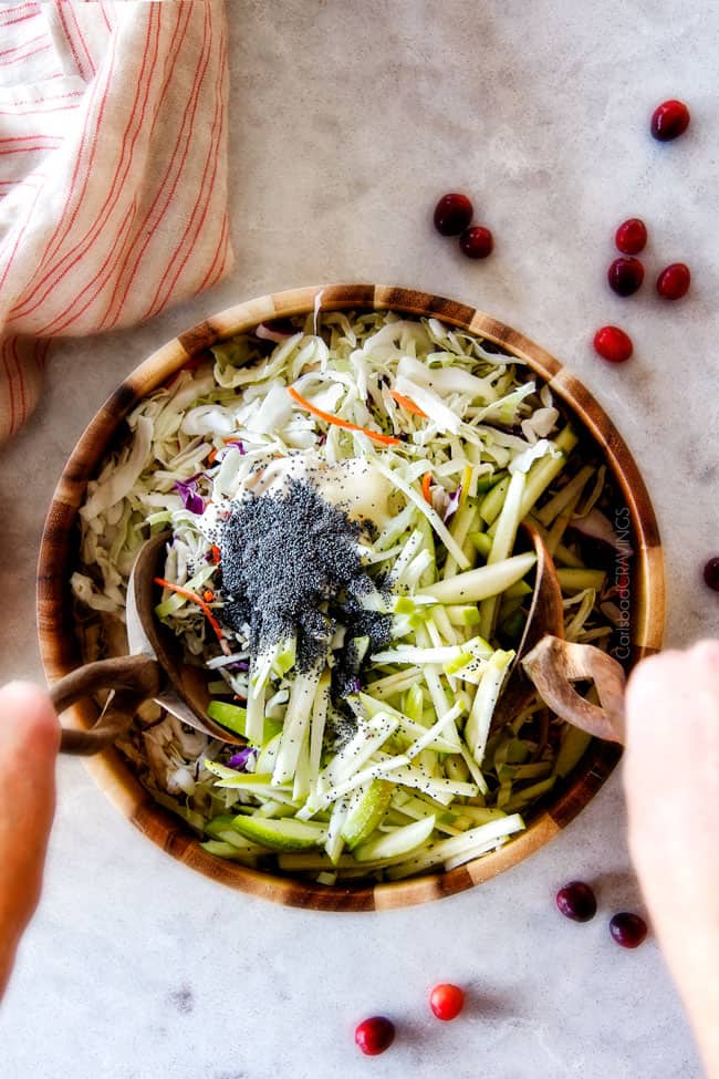 20 Minute Chipotle BBQ Cranberry Turkey Sliders (or chicken!) are a wonderfully delicious way to devour your Thanksgiving turkey leftovers or SO good you will want to make them forever and ever with chicken! And donโt skip the crunchy, sweet and tangy out of this world Apple Poppy Seed Slaw! top view showing how to make Thanksgiving turkey sliders by mixing coleslaw