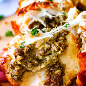 Easy Cheesy Pesto Sausage Ring is SO ADDICTING! my husband and I couldn't stop eating it and then I was craving it for days! You have to make this!!! The absolutely best holiday or game day appetizer!