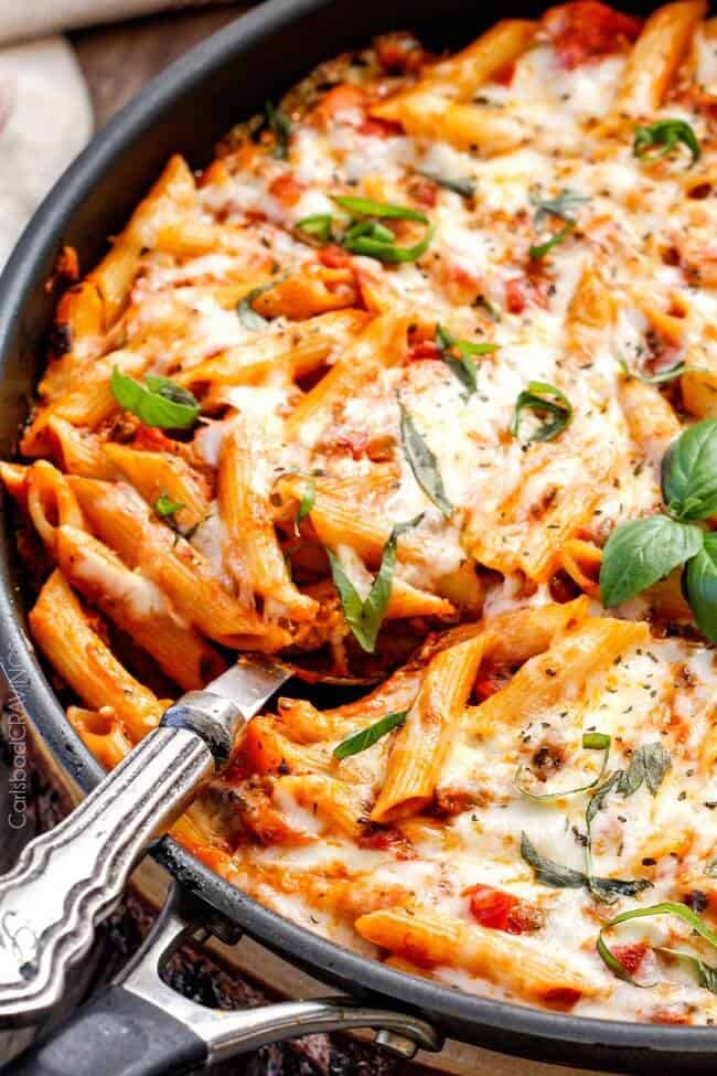 One Skillet Cheesy Penne - the best homemade ragu sauce simmered right with the pasta then loaded with cheese! My family begs me to make this weekly!