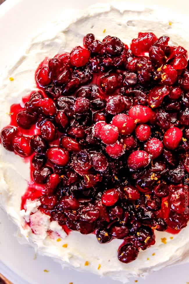 White Cake with Cranberries on top.