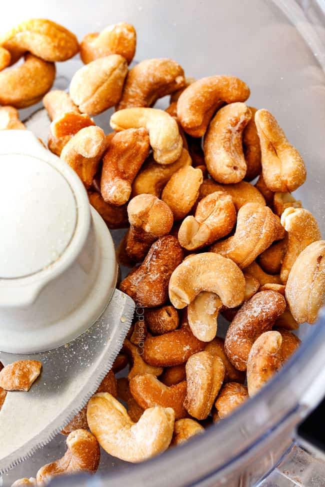 Showing how to make Baked Coconut Cashew Chicken Bites by blending cashews.