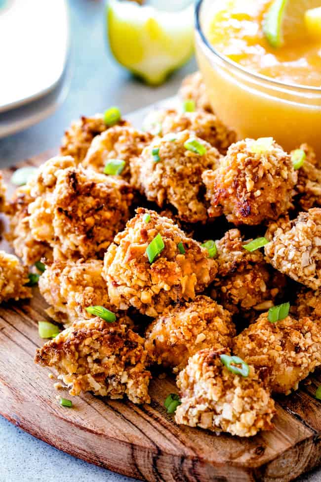 A stack of Baked Coconut Cashew Chicken Bites on a plate.