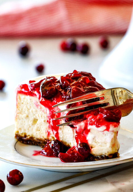 Cranberry Eggnog Cheesecake with Gingersnap Crust - this cheesecake is divine! Its become a family tradition because it tastes just like creamy eggnog and the Eggnog Cream Topping and Cranberry Topping make this worlds better than any other I've tried! A must for Christmas!