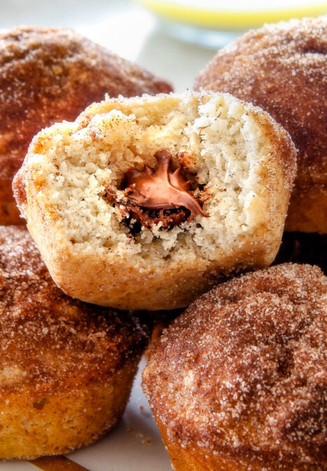EASY Nutella Stuffed Snickerdoodle Muffins AKA muffins dunked in butter and generously coated in cinnamon-sugar for a baked muffin that tastes like a fried donut AND each stuffed with creamy Nutella! These muffins are super quick to whip up and make the best special occasion breakfasts or dessert (like Christmas!)