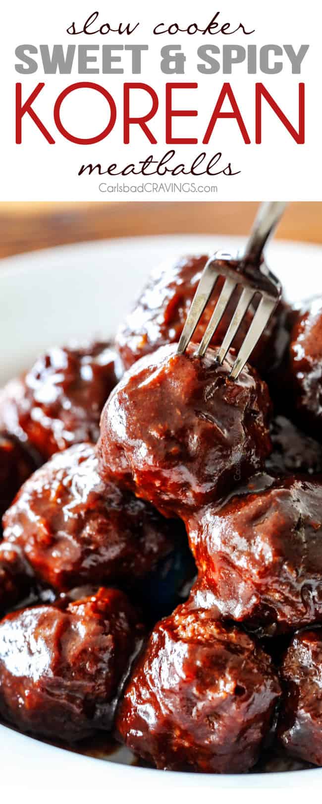 Tender juicy, sweet and spicy Slow cooker Korean Meatballs simmered in the most tantalizing sweet heat sauce that everyone goes crazy for! Perfect appetizer or delicious, easy meal with rice! Korean Meatballs stacked on a white plate with a fork stabbing one of the meatballs