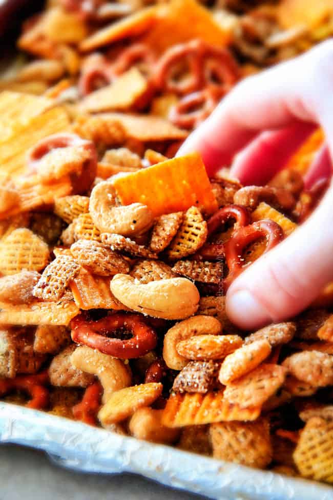 Make ahead crunchy, salty, savory Italian Parmesan Party Mix bursting with Italian flavor in each cashew, pretzel, chex mix bite! This is my go-to party snack that everyone begs me to make!