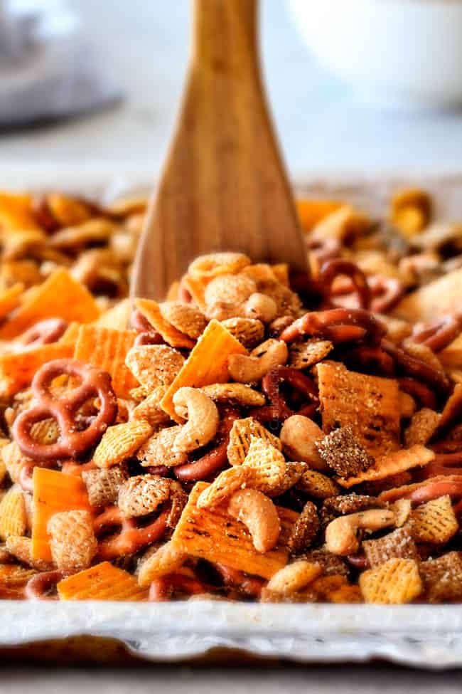 Make ahead crunchy, salty, savory Italian Parmesan Party Mix bursting with Italian flavor in each cashew, pretzel, chex mix bite! This is my go-to party snack that everyone begs me to make!