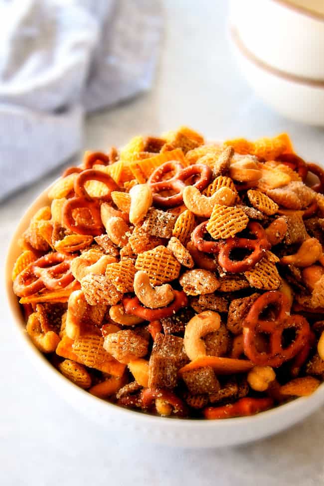Make ahead crunchy, salty, savory Italian Parmesan Party Mix bursting with Italian flavor in each cashew, pretzel, chex mix bite! This is my go-to party snack that everyone begs me to make!