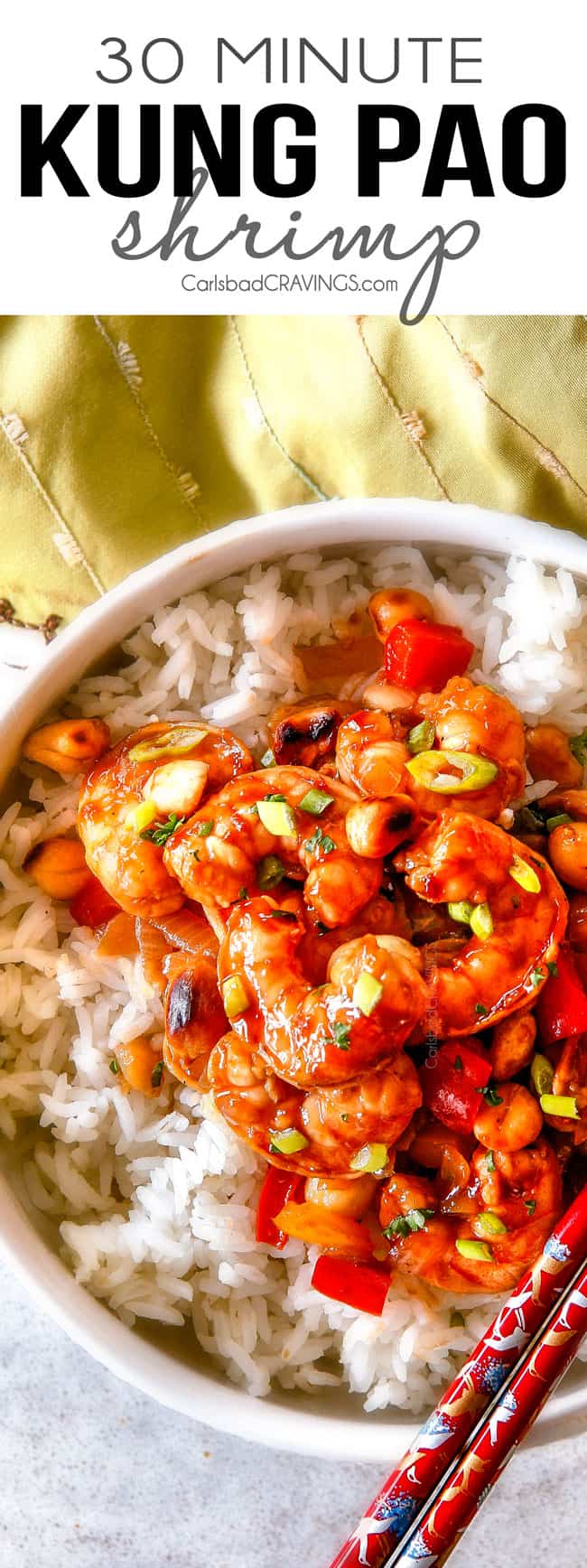This easy, healthy, Kung Pao Shrimp tastes better than takeout and is on your table in less than 30 minutes! I was licking my plate of the savory spicy sauce! top view of Kung Pao Shrimp in a bowl over white rice