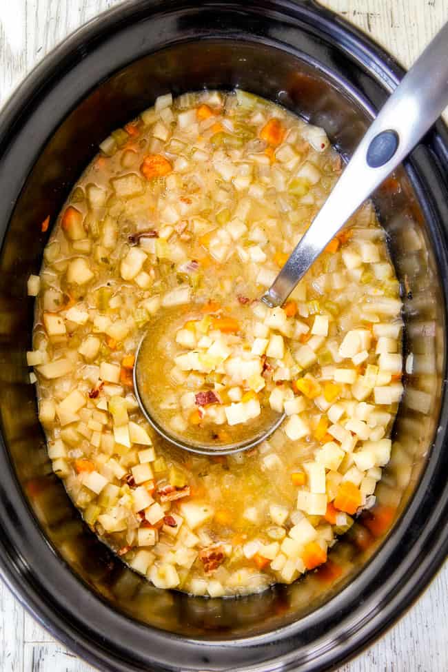 This Skinny Slow Cooker Potato Soup is unbelievably creamy, super flavorful and absolutely the best I've ever tried! and its super easy in the crock pot! showing how to make crockpot soup by cooking soup in crockpot until potatoes are fork tender