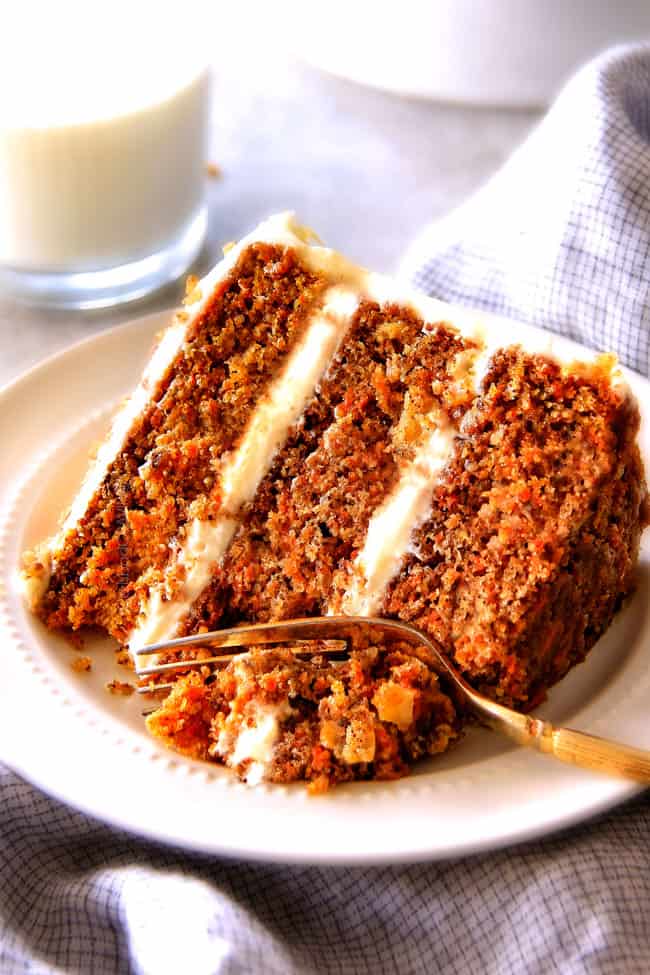 Layered Carrot Cake with Pineapple Cream Cheese Frosting - This is the BEST Carrot Cake Recipe, I will never make another recipe again! ! Super moist without being oily, spiced perfectly, and the Pineapple Cream Cheese Frosting is incredible! Brought this to a party and everyone was BEGGING me for the recipe!